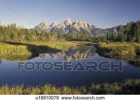 Grand Teton National Park, Snake River, Jackson Hole, WY, Wyoming, Scenic view of the Grand Teton Mountains reflecting in the calm waters of the Snake River in Grand Teton Nat'l Park in Wyoming. View Large Photo Image Stock Photo - Grand Teton National Park, Snake River, Jackson Hole, WY, Wyoming, Scenic view of the Grand Teton Mountains reflecting in the calm waters of the Snake River in Grand Teton Nat'l Park in Wyoming.. Fotosearch