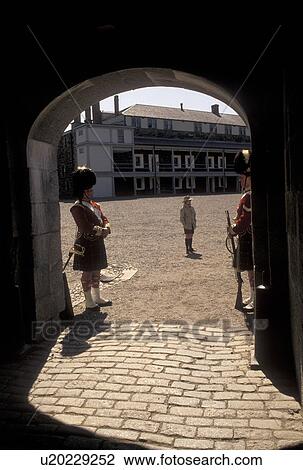 Stock Image -  Halifax, Citadel, Nova Scotia, NS, Canada, Guards stand at their post at the entrance to the Halifax Citadel National Historic Site in Halifax in Nova Scotia. . Fotosearch
