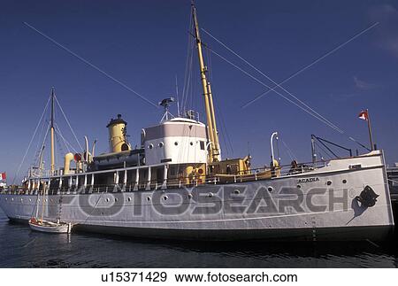 Stock Photo -  Halifax, Nova Scotia, NS, Canada, Atlantic Ocean, Halifax Harbour, The historic hydrographic vessel C. S. S. Acadia moored on the wharf at the Maritime Museum of the Atlantic on Halifax Harbour in the city of Halifax in Nova Scotia. . Fotosearch