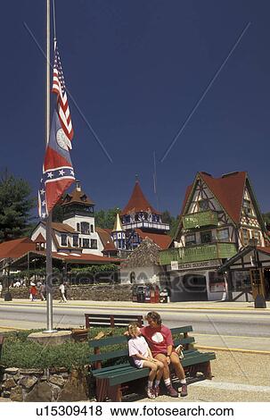 Helen, Alpine Village, GA, Georgia, Mother and nine year old daughter relax on a park bench along the main street in the alpine village of Helen in North Georgia. View Large Photo Image Stock Photo - Helen, Alpine Village, GA, Georgia, Mother and nine year old daughter relax on a park bench along the main street in the alpine village of Helen in North Georgia.. Fotosearch
