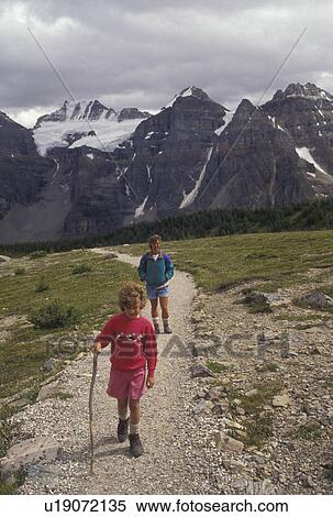 hiking, Banff National Park, Canada, Alberta, Canadian Rockies, Mother and six year old daughter hiking on a trail in Larch Valley in Banff National Park in Alberta. View Large Photo Image Stock Photography - hiking, Banff National Park, Canada, Alberta, Canadian Rockies, Mother and six year old daughter hiking on a trail in Larch Valley in Banff National Park in Alberta.. Fotosearch