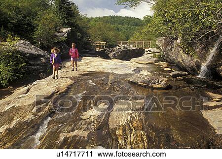 hiking, NC, Pisgah National Forest, North Carolina, Mother and nine year old daughter hiking at Second Falls at Graveyard Fields in Pisgah National Forest in North Carolina. View Large Photo Image Stock Image - hiking, NC, Pisgah National Forest, North Carolina, Mother and nine year old daughter hiking at Second Falls at Graveyard Fields in Pisgah National Forest in North Carolina.. Fotosearch