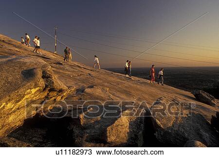 hiking, Stone Mountain, Atlanta, GA, Georgia, Georgia's Stone Mountain Park, People hiking up Stone Mountain, the largest single granite rock in the world, in Georgia's Stone Mountain Park. View Large Photo Image Stock Image - hiking, Stone Mountain, Atlanta, GA, Georgia, Georgia's Stone Mountain Park, People hiking up Stone Mountain, the largest single granite rock in the world, in Georgia's Stone Mountain Park.. Fotosearch