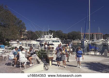Stock Image -  Hilton Head Island, SC, South Carolina, Outdoor cafT at Harbour Town Yacht Basin on Hilton Head Island.. Fotosearch