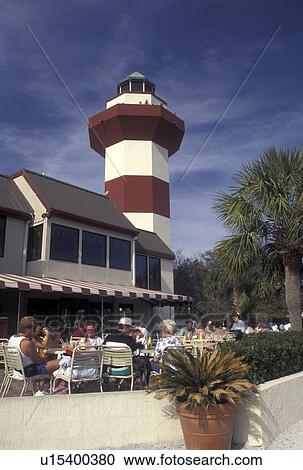 Hilton Head, SC, South Carolina, People sitting at an outdoor cafT below the Lighthouse at Harbour Town on Hilton Head Island. View Large Photo Image Stock Image -  Hilton Head, SC, South Carolina, People sitting at an outdoor cafT below the Lighthouse at Harbour Town on Hilton Head Island.. Fotosearch