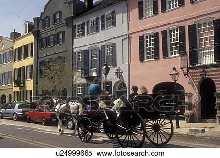 Stock Photography -  horse-drawn carriage, Charleston, South Carolina, SC, Carriage ride along Rainbow Row, a collection of colorful historical houses, along East Bay Street in Charleston in the spring.. Fotosearch