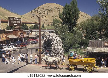 horse drawn wagon, Jackson, elk antler arch, WY, Wyoming, horse drawn wagon, Town Square Trolley picks up passengers in Town Square in downtown Jackson. View Large Photo Image Stock Image - horse drawn wagon, Jackson, elk antler arch, WY, Wyoming, horse drawn wagon, Town Square Trolley picks up passengers in Town Square in downtown Jackson.. Fotosearch