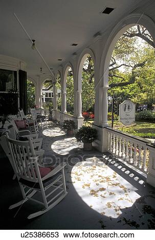 Stock Image -  hotel, inn, Charleston, South Carolina, SC, The front porch at Two Meeting Street Inn in downtown Charleston in the spring.. Fotosearch