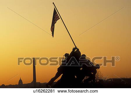 Stock Image -  Iwo Jima, Arlington, Virginia, VA, U. S. Flag, Washington, DC, District of Columbia, Marine Corps War Memorial, Iwo Jima, at sunrise in Arlington National Cemetery in Arlington.. Fotosearch