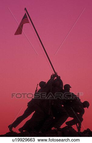 Stock Image -  Iwo Jima, sunrise, Arlington, VA, Arlington Nat'l Cemetery, Virginia, Silhouette of the U. S. Marine Corps Memorial, Iwo Jima, at the Arlington National Cemetery at sunrise.. Fotosearch