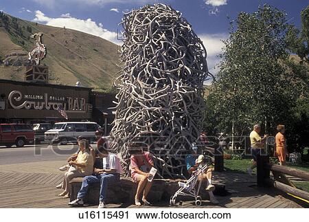 Jackson, elk antler, WY, Wyoming, People sitting under an arch made of elk antlers in Town Square in downtown Jackson. View Large Photo Image Stock Image - Jackson, elk antler, WY, Wyoming, People sitting under an arch made of elk antlers in Town Square in downtown Jackson.. Fotosearch
