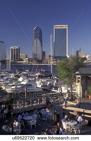 Jacksonville, FL, Florida, Outdoor cafT and marina along St. Johns River. View of skyline of downtown Jacksonville. View Large Photo Image Stock Image - Jacksonville, FL, Florida, Outdoor cafT and marina along St. Johns River. View of skyline of downtown Jacksonville.. Fotosearch