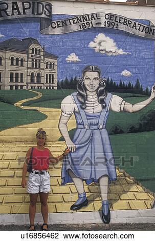 Judy Garland, mural, Grand Rapids, MN, Minnesota, Central School, Woman stands next to wall mural of Judy Garland in Grand Rapids. Actress Judy Garland's former school. View Large Photo Image Stock Image - Judy Garland, mural, Grand Rapids, MN, Minnesota, Central School, Woman stands next to wall mural of Judy Garland in Grand Rapids. Actress Judy Garland's former school.. Fotosearch