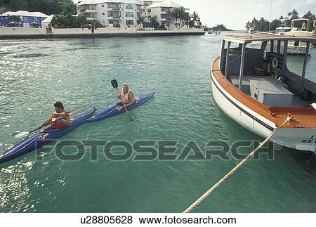 kayak, Bermuda, Smith's Parish, Couple kayaking in Flatt's Inlet in Smith's Parish in Flatts in Bermuda. View Large Photo Image Stock Photo - kayak, Bermuda, Smith's Parish, Couple kayaking in Flatt's Inlet in Smith's Parish in Flatts in Bermuda. . Fotosearch