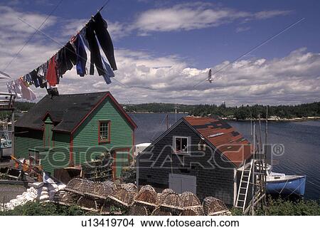 Picture -  laundry, Nova Scotia, West Dover, fishing village, NS, Canada, Atlantic Ocean, Clothes hanging on a line to dry in the fishing village of West Dover in Nova Scotia. . Fotosearch