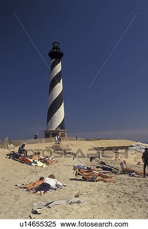 lighthouse, Cape Hatteras National Seashore, Outer Banks, North Carolina, NC, People sunbathing on the beach near Cape Hatteras Lighthouse on Cape Hatteras Nat'l Seashore on the Outer Banks. View Large Photo Image Stock Photography - lighthouse, Cape Hatteras National Seashore, Outer Banks, North Carolina, NC, People sunbathing on the beach near Cape Hatteras Lighthouse on Cape Hatteras Nat'l Seashore on the Outer Banks.. Fotosearch