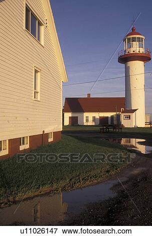 lighthouse, Gaspe Peninsula, Quebec, Sainte-Madelaine-de-la-Riviere-Madelaine, Canada, Gulf of St. Lawrence, Cap Madelaine lighthouse on Cap Madelaine on the Gaspe Peninsula on the St. Lawrence River in Quebec. View Large Photo Image Stock Photo - lighthouse, Gaspe Peninsula, Quebec, Sainte-Madelaine-de-la-Riviere-Madelaine, Canada, Gulf of St. Lawrence, Cap Madelaine lighthouse on Cap Madelaine on the Gaspe Peninsula on the St. Lawrence River in Quebec.. Fotosearch