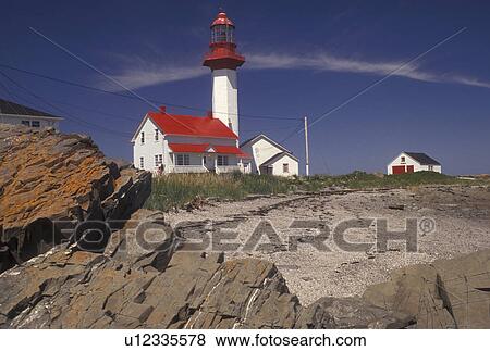 lighthouse, Gaspe Peninsula, Quebec, Metis-sur-Mer, Canada, Gulf of St. Lawrence, Pointe-de-Mitis Lighthouse with red roof in Metis-Sur-Mer along the St. Lawrence River on the Gaspe Peninsula in Quebec. View Large Photo Image Stock Photo - lighthouse, Gaspe Peninsula, Quebec, Metis-sur-Mer, Canada, Gulf of St. Lawrence, Pointe-de-Mitis Lighthouse with red roof in Metis-Sur-Mer along the St. Lawrence River on the Gaspe Peninsula in Quebec.. Fotosearch