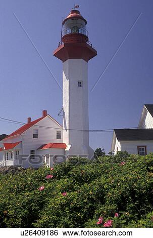 lighthouse, Gaspe Peninsula, Quebec, Metis-sur-Mer, Canada, Gulf of St. Lawrence, Pointe-de-Mitis Lighthouse with red roof in Metis-Sur-Mer along the St. Lawrence River on the Gaspe Peninsula in Quebec. View Large Photo Image Stock Photograph - lighthouse, Gaspe Peninsula, Quebec, Metis-sur-Mer, Canada, Gulf of St. Lawrence, Pointe-de-Mitis Lighthouse with red roof in Metis-Sur-Mer along the St. Lawrence River on the Gaspe Peninsula in Quebec.. Fotosearch