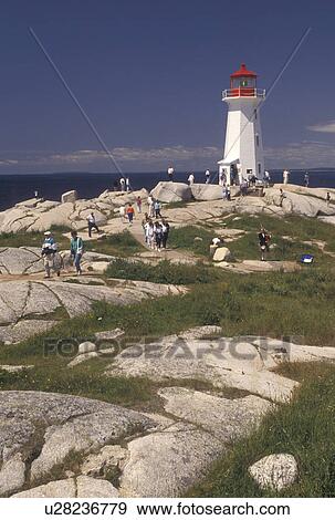 lighthouse, Peggy's Cove, fishing village, Nova Scotia, NS, Canada, Atlantic Ocean, The old lighthouse stands on top of a massive granite rock in Peggy's Cove in Nova Scotia. View Large Photo Image Stock Photo - lighthouse, Peggy's Cove, fishing village, Nova Scotia, NS, Canada, Atlantic Ocean, The old lighthouse stands on top of a massive granite rock in Peggy's Cove in Nova Scotia. . Fotosearch
