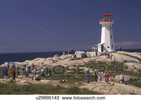 lighthouse, Peggy's Cove, Nova Scotia, fishing village, NS, Canada, Atlantic Ocean, The old lighthouse stands on top of a massive granite rock in Peggy's Cove in Nova Scotia. View Large Photo Image Stock Image - lighthouse, Peggy's Cove, Nova Scotia, fishing village, NS, Canada, Atlantic Ocean, The old lighthouse stands on top of a massive granite rock in Peggy's Cove in Nova Scotia. . Fotosearch
