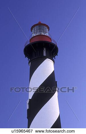 Stock Photo -  lighthouse, St. Augustine, FL, Florida, St. Augustine Lighthouse against a blue sky on Anastasia Island in Saint Augustine.. Fotosearch