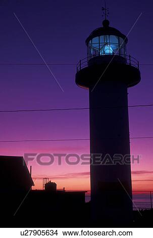 Picture -  lighthouse, sunrise, Gaspe Peninsula, Quebec, Sainte-Madelaine-de-la-Riviere-Madelaine, Canada, Gulf of St. Lawrence, Cap Madelaine lighthouse at sunrise on Cap Madelaine on the Gaspe Peninsula on the St. Lawrence River in Quebec.. Fotosearch