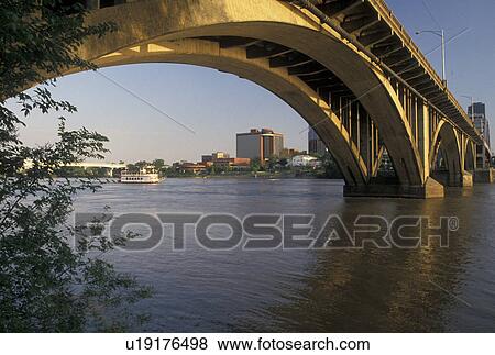 Little Rock, bridge, AR, Arkansas, Bridge crosses the Arkansas River and a view of the downtown skyline of Little Rock. View Large Photo Image Stock Photo - Little Rock, bridge, AR, Arkansas, Bridge crosses the Arkansas River and a view of the downtown skyline of Little Rock.. Fotosearch