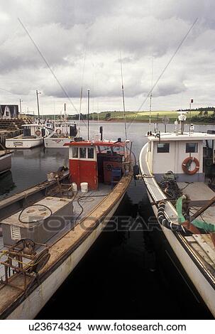 lobster fishing boats, Prince Edward Island, Canada, P. E. I Gulf of St. Lawrence, Fishing boats docked in the harbor of the fishing village of French River on Prince Edward Island. View Large Photo Image Picture - lobster fishing boats, Prince Edward Island, Canada, P. E. I Gulf of St. Lawrence, Fishing boats docked in the harbor of the fishing village of French River on Prince Edward Island.. Fotosearch