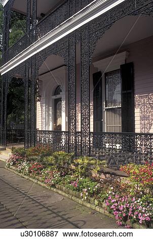 mansion, Garden District, New Orleans, LA, Louisiana, Ornate mansion with cast iron railings in the Garden District in New Orleans. View Large Photo Image Stock Photo - mansion, Garden District, New Orleans, LA, Louisiana, Ornate mansion with cast iron railings in the Garden District in New Orleans. . Fotosearch
