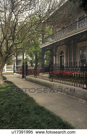 Stock Photography -  mansion, New Orleans, Garden District, Louisiana, LA, Ornate mansion with cast-iron railings in the Garden District in New Orleans. . Fotosearch