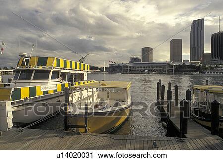 Miami, water taxi, FL, Florida, Atlantic Ocean, Yellow water taxi docked outside Bayside Marketplace, a shopping, dining, entertainment mecca, on Biscayne Bay in downtown Miami. View Large Photo Image Stock Image - Miami, water taxi, FL, Florida, Atlantic Ocean, Yellow water taxi docked outside Bayside Marketplace, a shopping, dining, entertainment mecca, on Biscayne Bay in downtown Miami.. Fotosearch