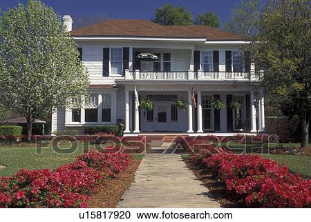 Stock Image -  Mobile, AL, Alabama, Historical house on Old Government Street and azaleas in Mobile.. Fotosearch