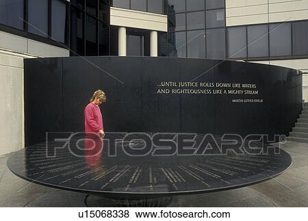 Montgomery, AL, Civil Rights Memorial, Alabama, A woman looks at the inscriptions written in the Civil Rights Memorial which stands in front of the Southern Poverty Law Center in Montgomery. View Large Photo Image Stock Photo - Montgomery, AL, Civil Rights Memorial, Alabama, A woman looks at the inscriptions written in the Civil Rights Memorial which stands in front of the Southern Poverty Law Center in Montgomery.. Fotosearch