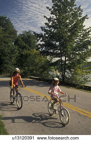 mother, daughter, biking, Stone Mountain, GA, Atlanta, Georgia, Mother and eight year old daughter biking with helmets on at Georgia's Stone Mountain Park in Stone Mountain. View Large Photo Image Stock Image - mother, daughter, biking, Stone Mountain, GA, Atlanta, Georgia, Mother and eight year old daughter biking with helmets on at Georgia's Stone Mountain Park in Stone Mountain. . Fotosearch