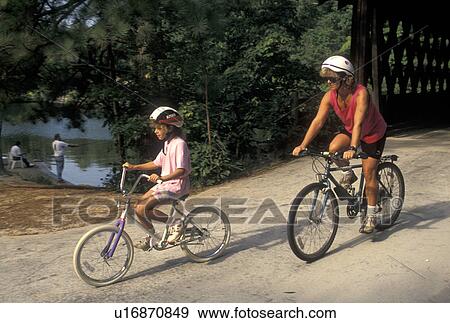 mother, daughter, biking, Stone Mountain, GA, Atlanta, Georgia, Mother and eight year old daughter biking with helmets on at Georgia's Stone Mountain Park in Stone Mountain. View Large Photo Image Stock Photo - mother, daughter, biking, Stone Mountain, GA, Atlanta, Georgia, Mother and eight year old daughter biking with helmets on at Georgia's Stone Mountain Park in Stone Mountain. . Fotosearch