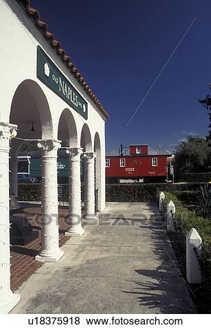 Naples, FL, Gulf of Mexico, Florida, A red caboose parked outside the Naples Depot Civic & Cultural Center is housed in a renovated 1927 train station in Naples. View Large Photo Image Stock Photo - Naples, FL, Gulf of Mexico, Florida, A red caboose parked outside the Naples Depot Civic & Cultural Center is housed in a renovated 1927 train station in Naples.. Fotosearch