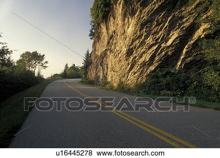 Stock Photo -  NC, Blue Ridge Parkway, road, North Carolina, Blue Ridge, The Blue Ridge Parkway is a scenic drive winding through the mountains of North Carolina.. Fotosearch