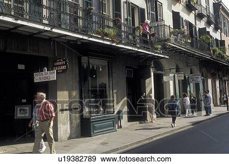 New Orleans, French Quarter, Louisiana, LA, People walking along the street in the French Quarter of New Orleans. View Large Photo Image Stock Photo - New Orleans, French Quarter, Louisiana, LA, People walking along the street in the French Quarter of New Orleans. . Fotosearch