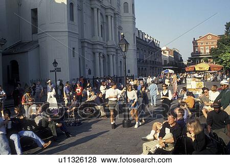 New Orleans, LA, French Quarter, St. Louis Cathedral, Louisiana, Crowd of people outside the Saint Louis Cathedral watching a street artist in Jackson Square in the French Quarter in New Orleans. View Large Photo Image Stock Photo - New Orleans, LA, French Quarter, St. Louis Cathedral, Louisiana, Crowd of people outside the Saint Louis Cathedral watching a street artist in Jackson Square in the French Quarter in New Orleans. . Fotosearch