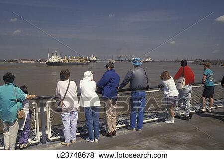 New Orleans, Louisiana, LA, People looking a ships traveling on the Mississippi River from Canal Street Ferry in New Orleans. View Large Photo Image Stock Photo - New Orleans, Louisiana, LA, People looking a ships traveling on the Mississippi River from Canal Street Ferry in New Orleans.. Fotosearch