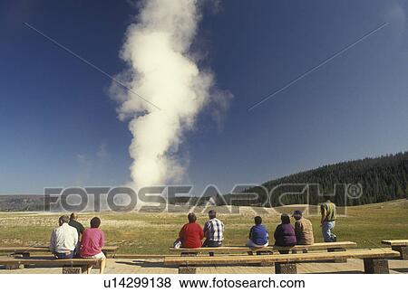 Old Faithful, Yellowstone National Park, WY, geyser, Wyoming, People watching Old Faithful erupt in Yellowstone Nat'l Park in Wyoming. View Large Photo Image Stock Photo - Old Faithful, Yellowstone National Park, WY, geyser, Wyoming, People watching Old Faithful erupt in Yellowstone Nat'l Park in Wyoming.. Fotosearch