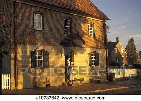 Old Salem, Winston-Salem, NC, North Carolina, Women in authentic Moravian costumes outside Winkler Bakery in Old Salem, a living history restoration of the Moravian Church town of Salem founded in 1766, in the fall in Winston-Salem. View Large Photo Image Stock Image - Old Salem, Winston-Salem, NC, North Carolina, Women in authentic Moravian costumes outside Winkler Bakery in Old Salem, a living history restoration of the Moravian Church town of Salem founded in 1766, in the fall in Winston-Salem.. Fotosearch