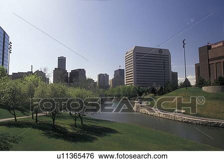 Stock Photograph -  Omaha, NE, Nebraska, Downtown skyline of Omaha from Gene Leahy Mall.. Fotosearch