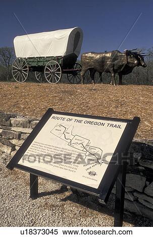 Oregon Trail, covered wagon, KS, Kansas, Sign showing the route of the Oregon Trail. Statue of covered wagon pulled by a team of oxen along the Oregon Trail in Kansas. View Large Photo Image Stock Photography - Oregon Trail, covered wagon, KS, Kansas, Sign showing the route of the Oregon Trail. Statue of covered wagon pulled by a team of oxen along the Oregon Trail in Kansas.. Fotosearch