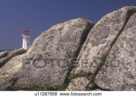 Stock Photo -  Peggy's Cove, Nova Scotia, lighthouse, NS, Canada, Atlantic Ocean, The old lighthouse stands on top of a massive granite rock in Peggy's Cove in Nova Scotia. . Fotosearch