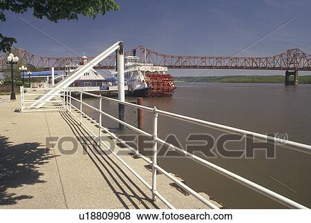 Stock Photo -  Peoria, IL, Illinois, Riverboat docked at Riverfront Park along the Illinois River in Peoria.. Fotosearch