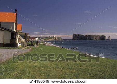Stock Photo -  Perce, Gaspe Peninsula, Quebec, Canada, Rocher Perce, Gulf of St. Lawrence, Scenic view of Rocher Perce (Perce Rock) on the Gulf of St. Lawrence in Perce on Gaspe Peninsula in Quebec.. Fotosearch