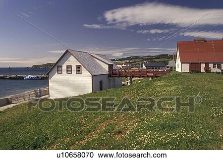 Stock Image -  Perce, Quebec, Gaspe Peninsula, Canada, Gulf of St. Lawrence, Scenic view of Perce on the Gulf of St. Lawrence and Le Chafaud museum on Gaspe Peninsula in Quebec.. Fotosearch
