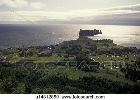 Perce Rock, Gaspe Peninsula, Perce, Quebec, Canada, Gulf of St. Lawrence, Scenic aerial view of Rocher Perce (Perce Rock) and the town of Perce on the Gulf of St. Lawrence on Gaspe Peninsula in Quebec. View Large Photo Image Stock Photo - Perce Rock, Gaspe Peninsula, Perce, Quebec, Canada, Gulf of St. Lawrence, Scenic aerial view of Rocher Perce (Perce Rock) and the town of Perce on the Gulf of St. Lawrence on Gaspe Peninsula in Quebec.. Fotosearch